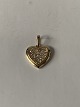 Heart-shaped pendant in 14 carat gold, with zircons. Very exclusive.