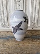 Royal Copenhagen Art Nouveau vase decorated with crows flying over a winter 
landscape no. 1412/47D