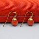 Ole Lynggaard; Dew Drop earrings of 18k gold with coral Ole Lynggaard; Dew Drop earrings of 18k gold with coral