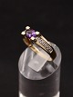 14 carat gold ring with amethyst and several small diamonds