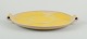Finnish ceramic dish in Art Deco style. With two handles.
Yellow glaze. Hand painted.