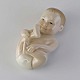 Kinnerup Antik 
& Porcelæn 
præsenterer: 
RC figur
027
Liggende baby
12 cm