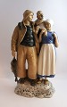 Bing & Grøndahl. Porcelænsfigur. Fisker familie. Model 2025. Højde 31 cm. (1 
sortering). Lille medfødt fejl på fiskenet.