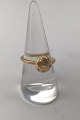 Danam Antik 
præsenterer: 
Dulong 
Fine Jewellery 
18K Guld 
Mushroom Ring 
(7 Brillanter)
