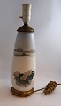 Lundin Antique 
präsentiert: 
Royal 
Copenhagen. 
Porzellanlampe 
mit 
Bronzefassung. 
Modell 1274 / 
184. Höhe 40 
cm. ...