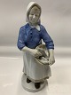 Figure of Fisherwoman with fish in basket
Height 24 cm.