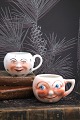 Old faience cups with handles and funny faces from ...