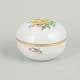 Meissen, lidded jar with polychrome flower decoration.