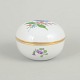 Meissen, lidded jar with polychrome flower decoration.