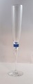 Lundin Antique præsenterer: Attica, Royal Copenhagen med blå deco. Design Anja Kjær. Champagne glas. Højde 29 cm.