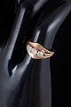 14 carat gold ring with three colourless stones.