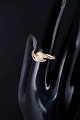 8 carat gold ring with four white stones.