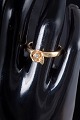 8 carat gold ring with white stone.