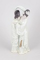 L'Art præsenterer: Kinesisk porcelænsfigur.