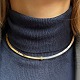 Antik Damgaard-Lauritsen præsenterer: Georg Jensen; Halsring i sterling sølv og forgyldt sølv, no. A 21B