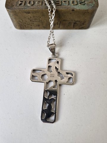 Silver necklace with large silver cross decorated with flowers by Eiler & Marløe