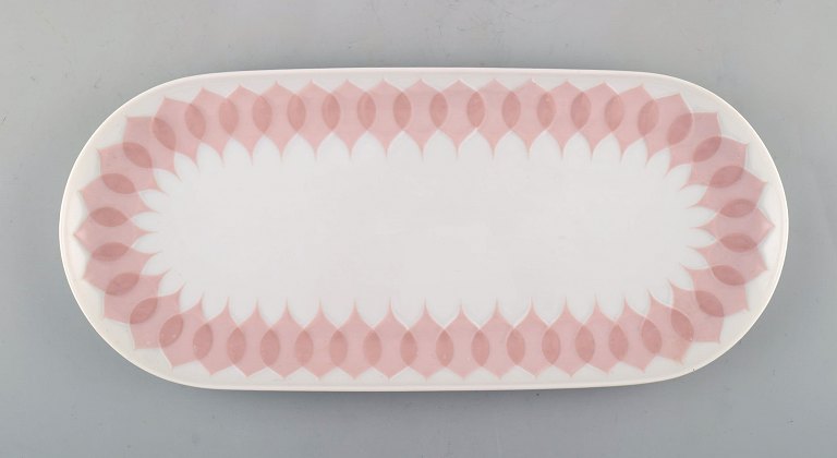 Bjørn Wiinblad for Rosenthal. "Lotus" porcelain service. Oblong dish decorated 
with pink lotus leaves. 1980