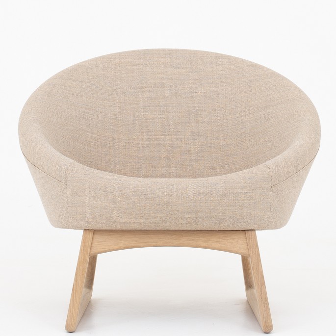 Kurt Østervig / Klassik Studio
57A - Tub chair upholstered in Foss color 212 with cushion in Foss color 272 on 
sledgebase in soaped oak.
Availability: 6-8 weeks
Original condition
