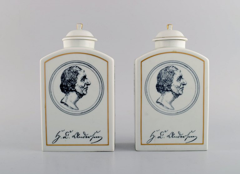 A pair of Bing & Grondahl H.C. Andersen tea caddies in porcelain with motifs 
from Copenhagen and Odense.
