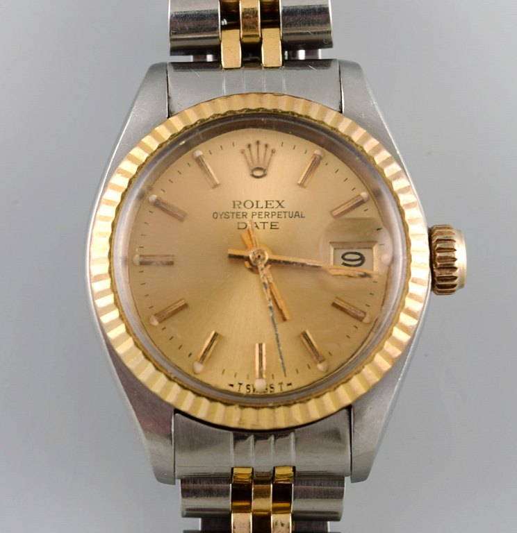 Rolex Oyster Lady Perpetual Gold Date. Damearmbåndsur, original lænke i stål og 
18 karat guld. 1970/80