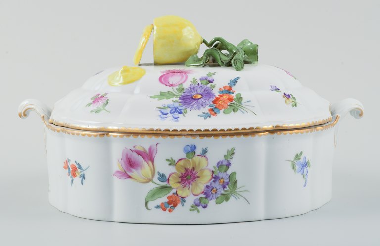 Nymphenburg, Germany, hand-painted porcelain lidded tureen with polychrome 
flowers, lid knob in the shape of a lemon.