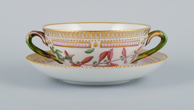 Royal Copenhagen Flora Danica boullion cup with saucer in hand-painted porcelain 
with branch-shaped handles, flowers and gold decoration. 
PROVENANCE : VALDEMARS CASTLE