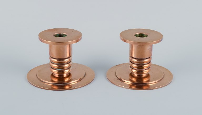 Evan Jensen, bronze caster in Copenhagen, Denmark, a pair of Art Deco bronze 
candleholders.