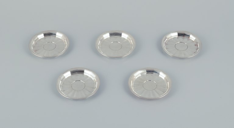 Georg Jensen. A set of five bottle coasters in sterling silver. Rare model.