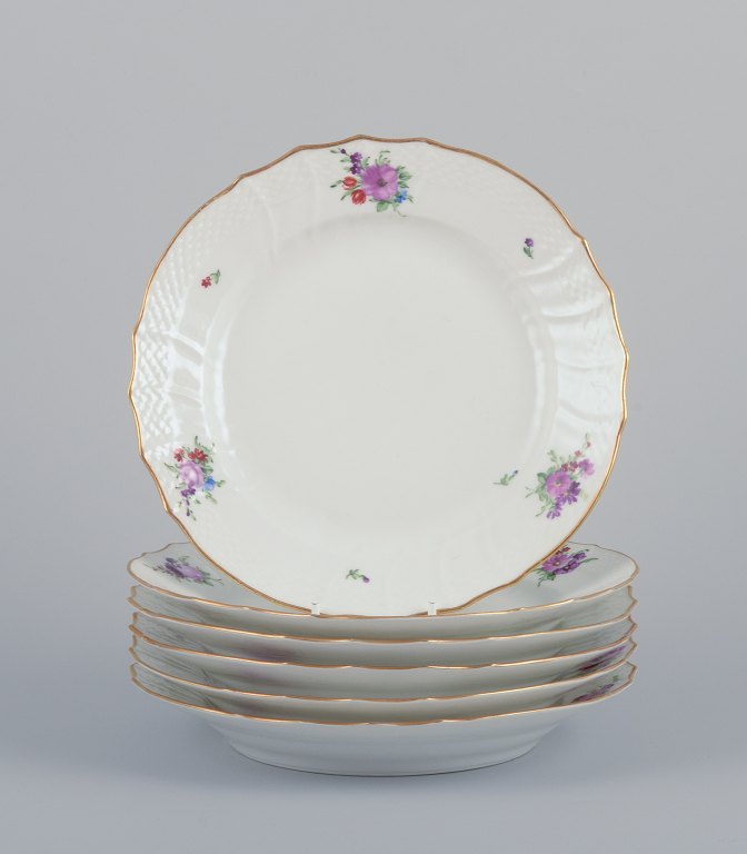 Royal Copenhagen Saxon Flower. Six lunch plates in porcelain. Hand-painted with 
polychrome flowers. Gold rim.