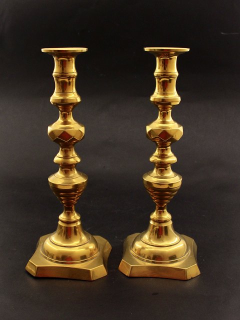 A pair of English brass candlesticks