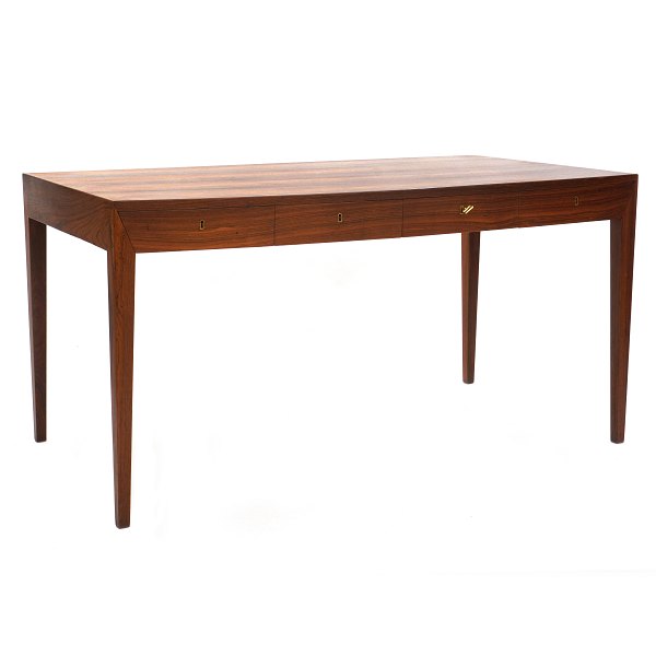 Rosewood veneered writing table by Severin Hansen, Denmark. Manufactured by 
Haslev Møbelsnedkeri. Nice condition. H: 74cm. Plate: 75x143cm