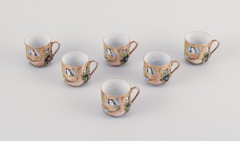 Satsuma, Japan. Six small teacups.
Hand-decorated porcelain with classic scenes.