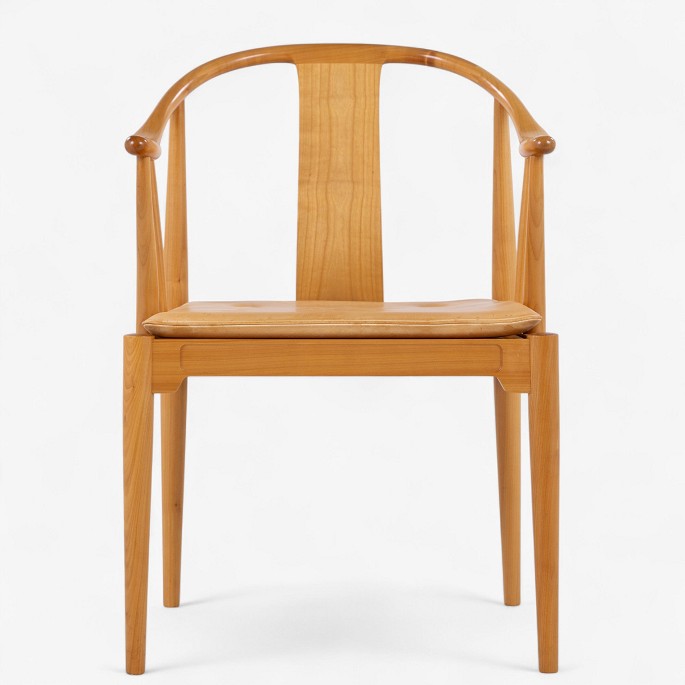 Hans J. Wegner / Fritz Hansen.
FH 4283 - Chinese chair in cherry with cushion in patinated natural leather. 
Manufacturer
